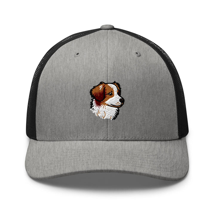 a gray and black trucker hat with a brown and white dog&#39;s face