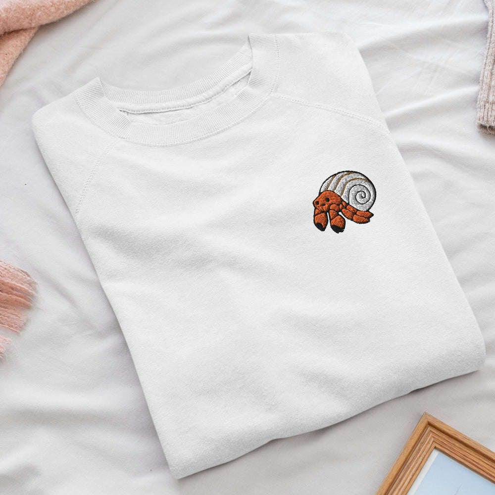 a white t - shirt with a picture of a hand on it