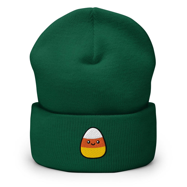a green beanie with a cartoon face on it