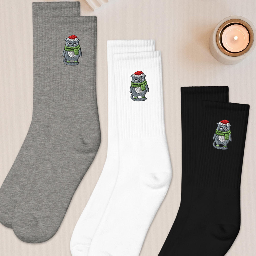 three pairs of socks with cartoon characters on them