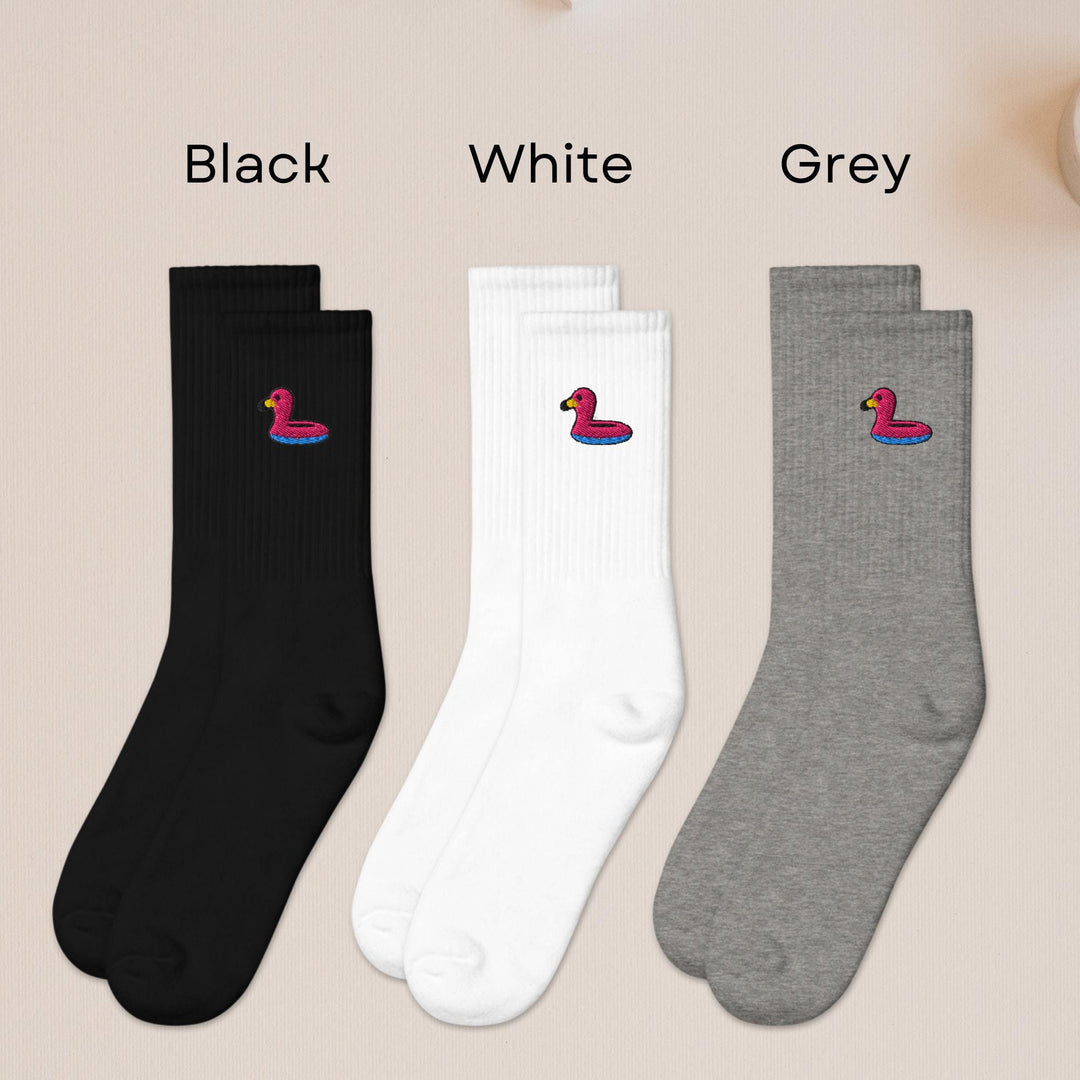 three pairs of black, white, and grey socks