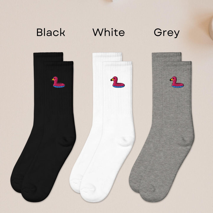 three pairs of black, white, and grey socks