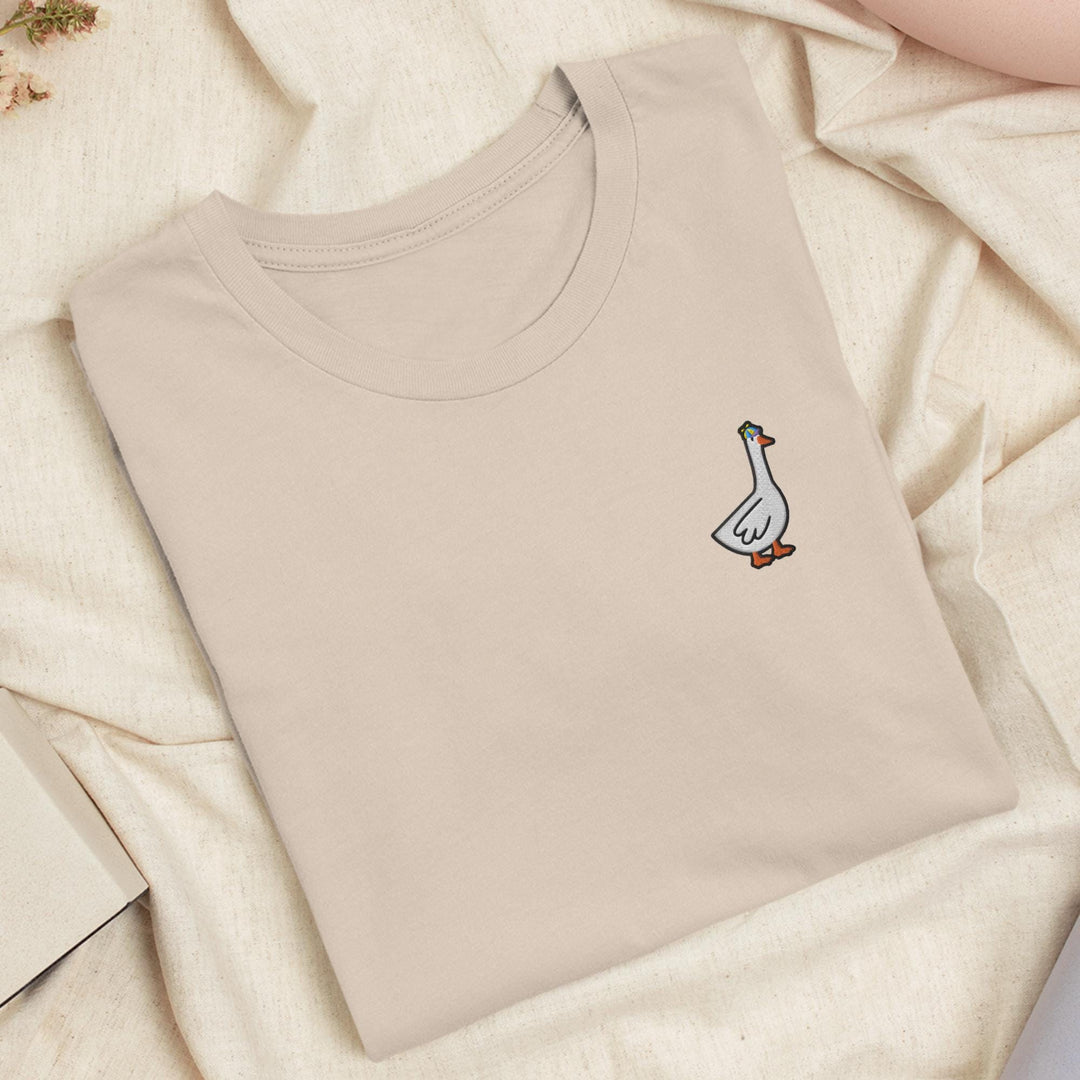 a t - shirt with a picture of a goose on it