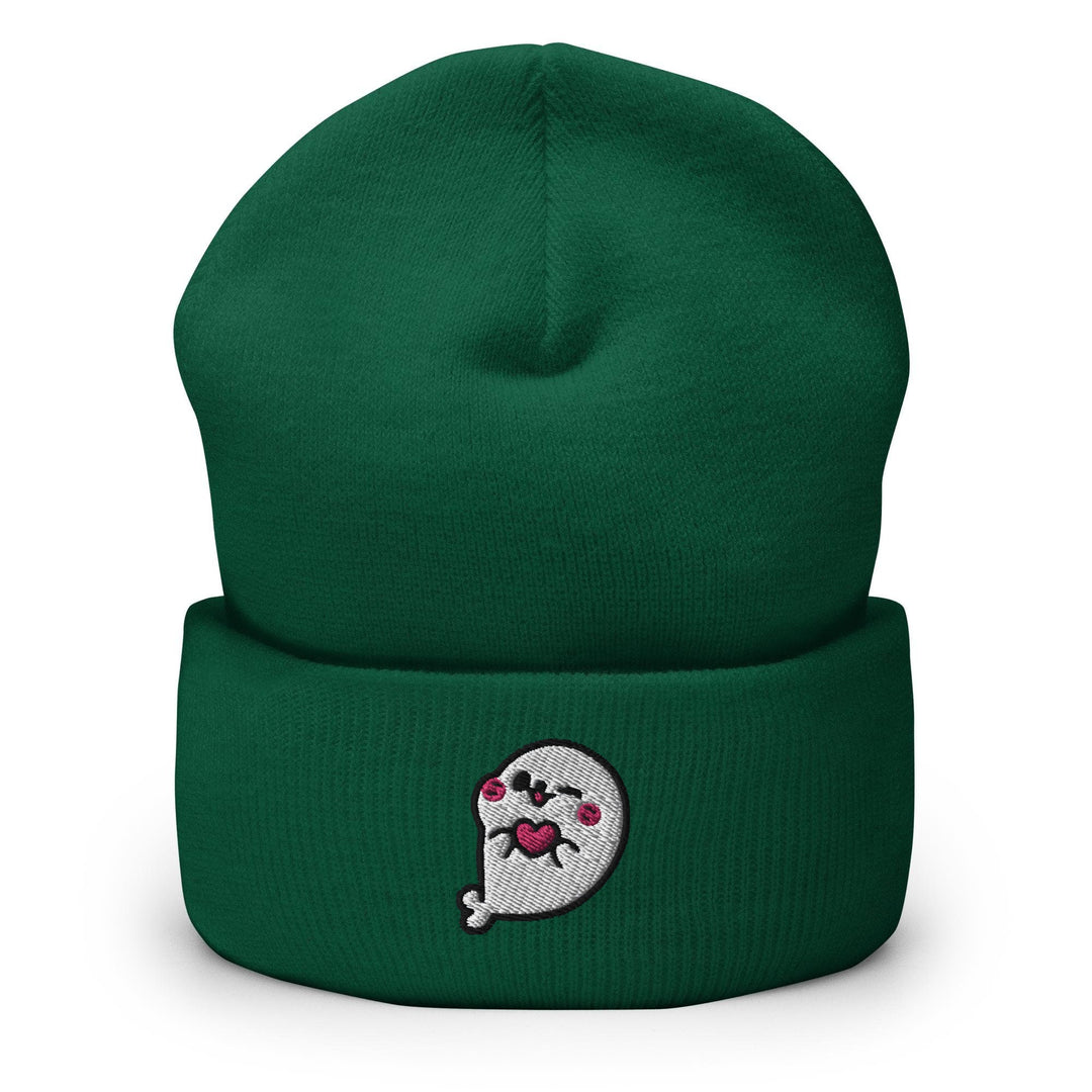 a green beanie with a cartoon character on it