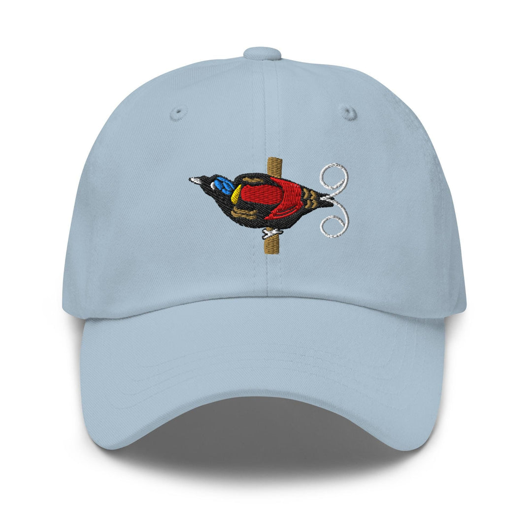 a blue hat with a bird embroidered on it