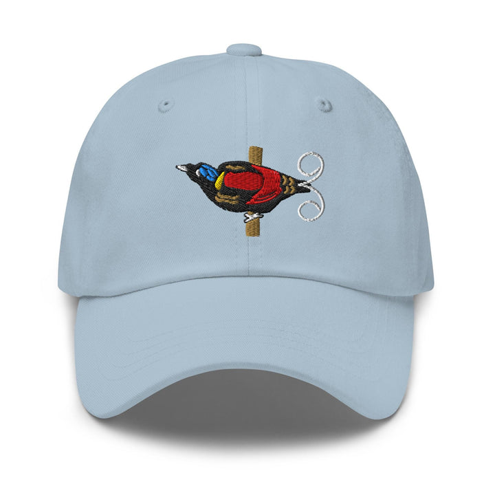 a blue hat with a bird embroidered on it