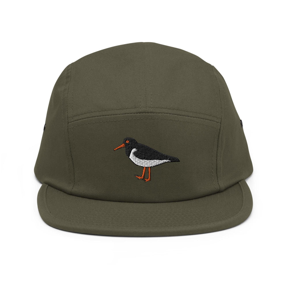 a green hat with a bird embroidered on it