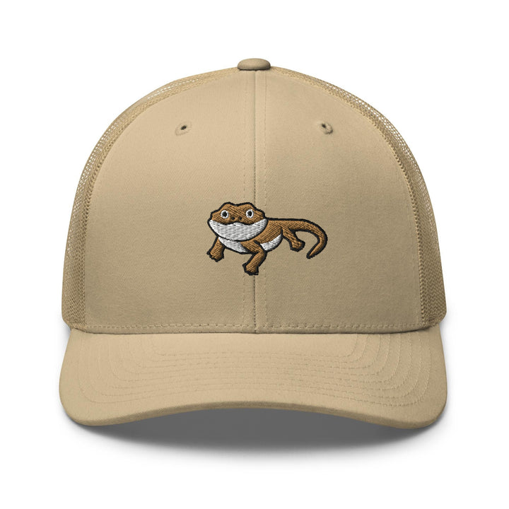 a tan trucker hat with an image of a monkey on it