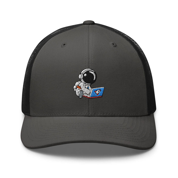 a gray and black trucker hat with an astronaut on it