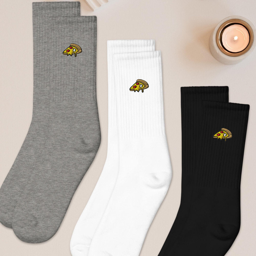 three pairs of socks sitting on top of a table