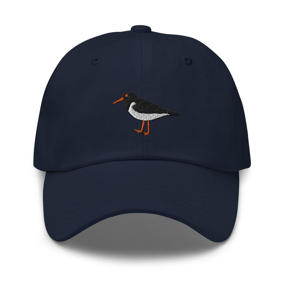 a blue hat with a bird embroidered on it