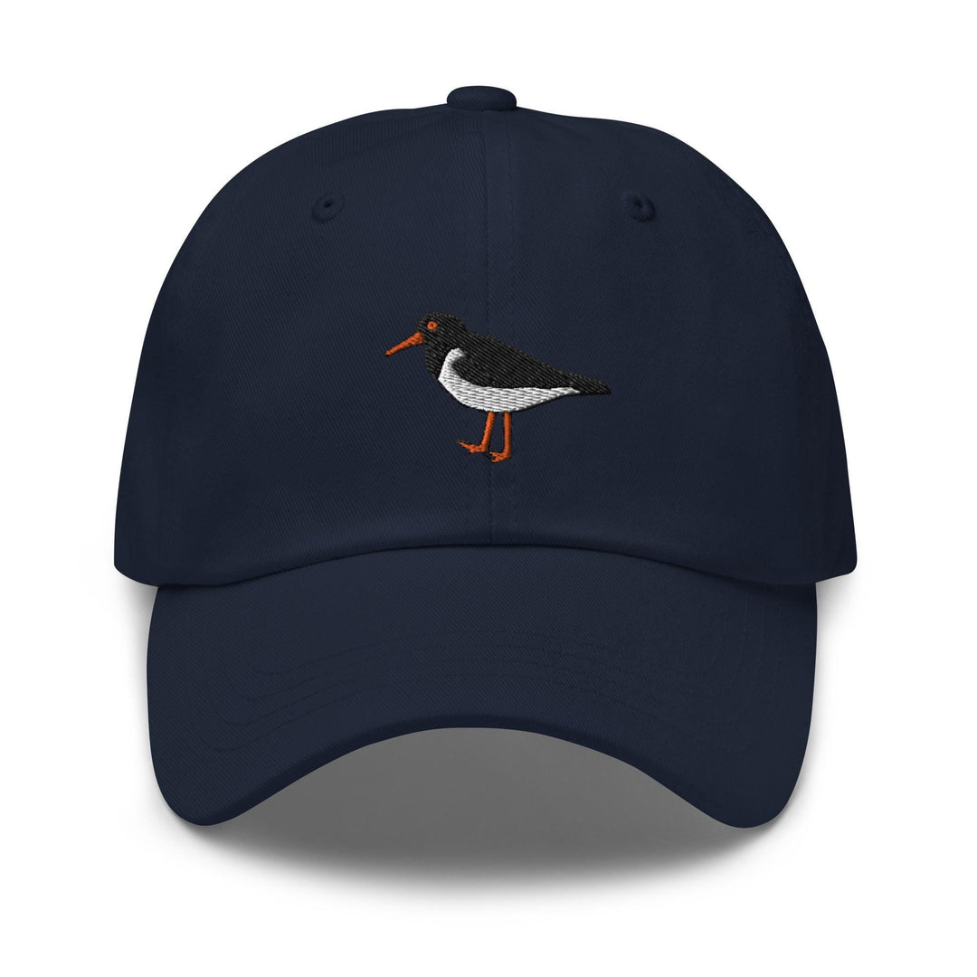 a blue hat with a bird embroidered on it