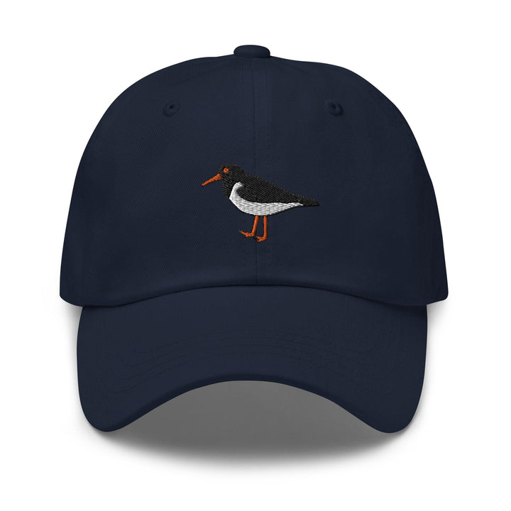 a blue hat with a bird embroidered on it