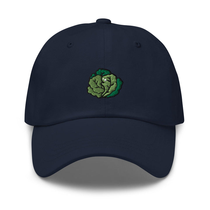 a blue hat with a green vegetable embroidered on it