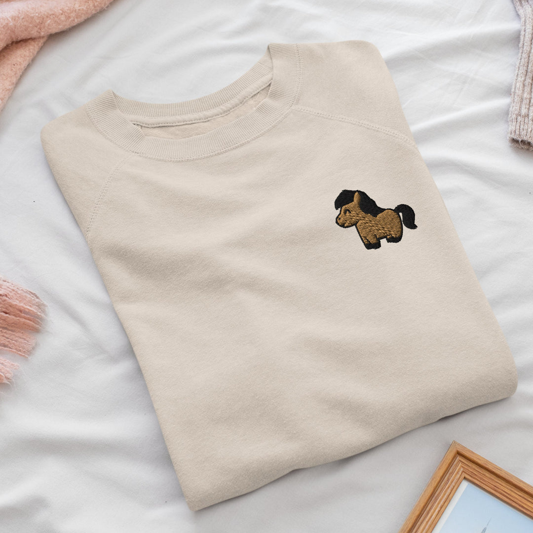 a t - shirt with a dog embroidered on it