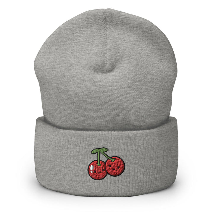 a grey beanie with two cherries on it