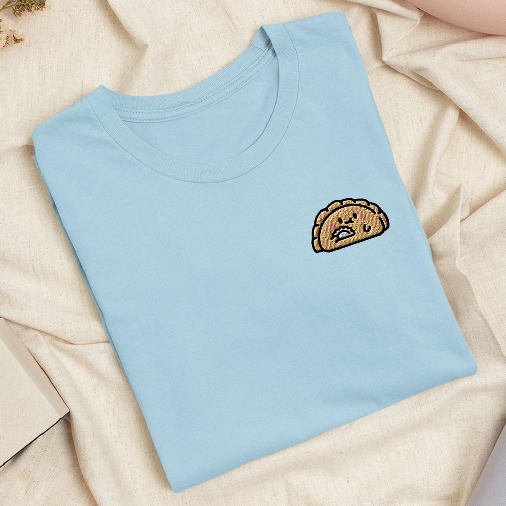 a blue t - shirt with a picture of a piece of bread on it