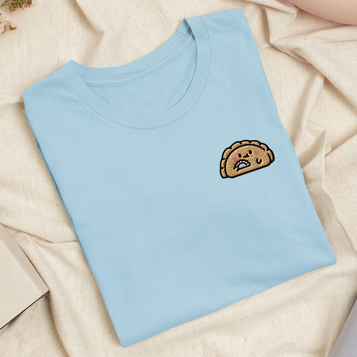 a blue t - shirt with a picture of a piece of bread on it