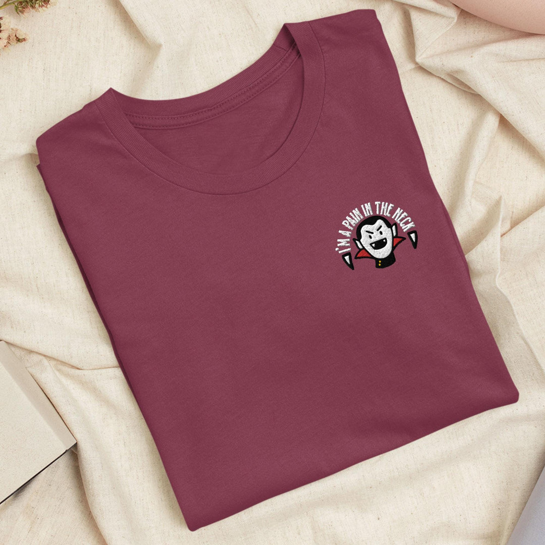a red t - shirt with a panda face on it