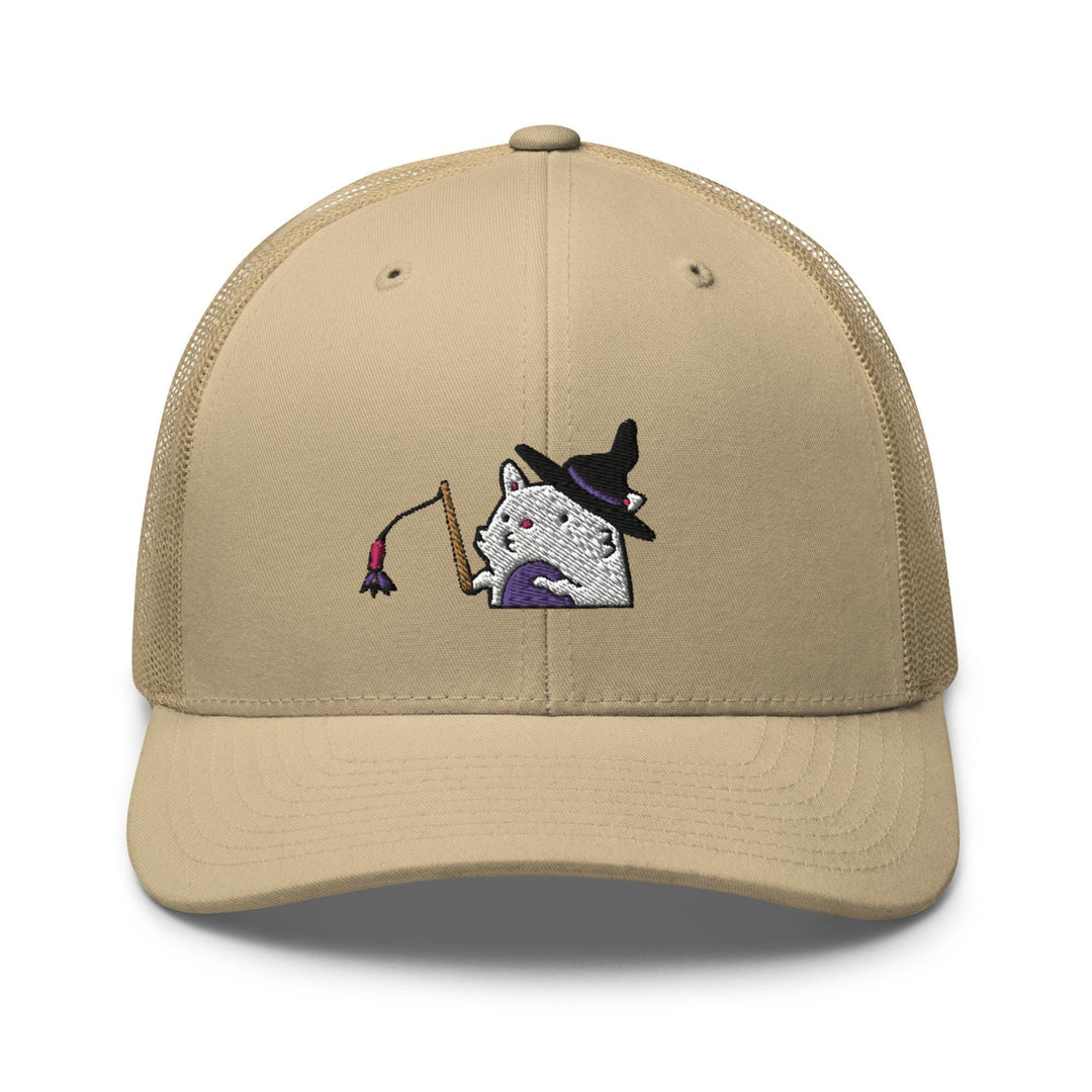 a tan hat with a picture of a cat wearing a witches hat