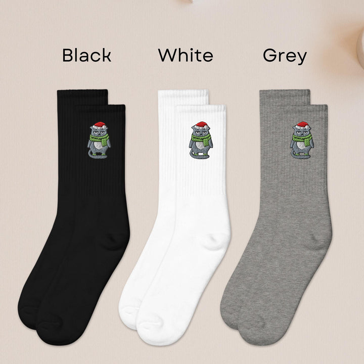 three pairs of socks with cartoon characters on them