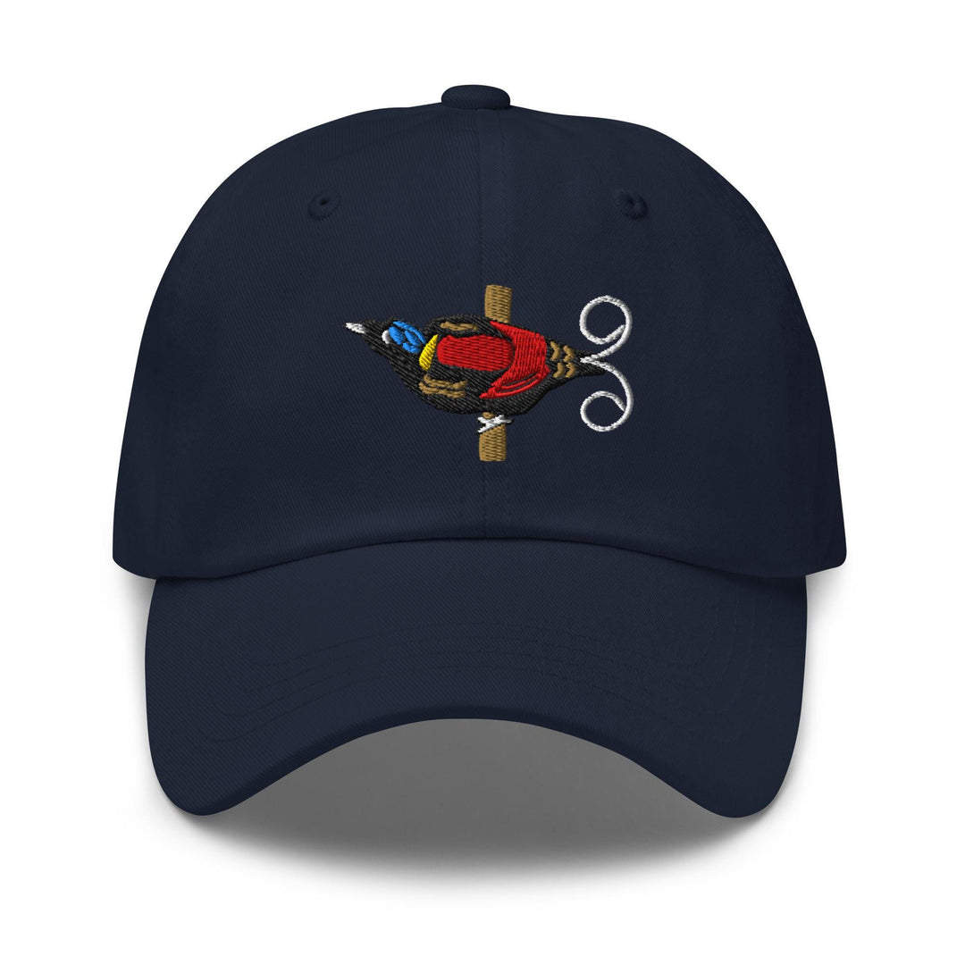 a blue hat with a picture of a bird on it