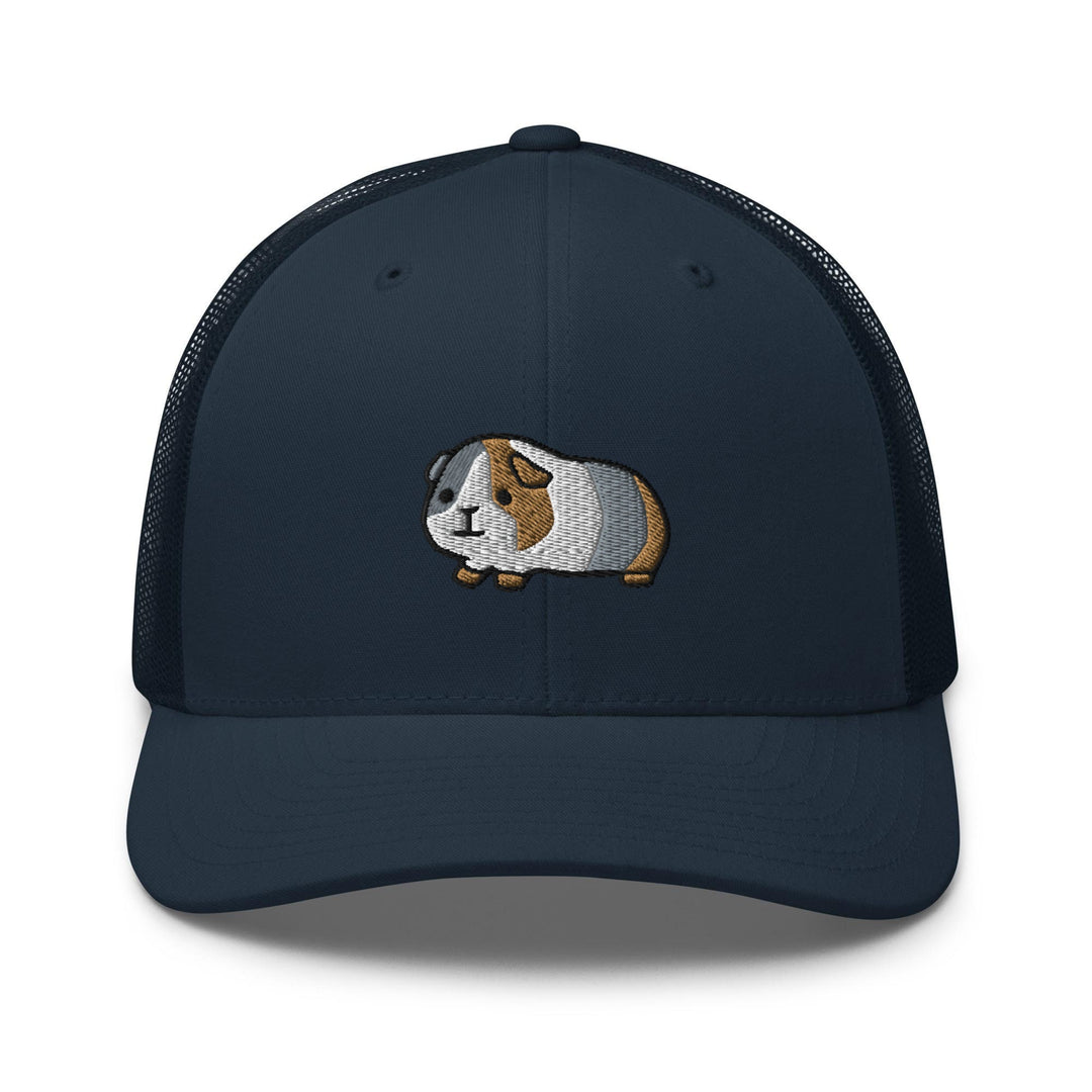 a blue cap with a brown and white dog on it