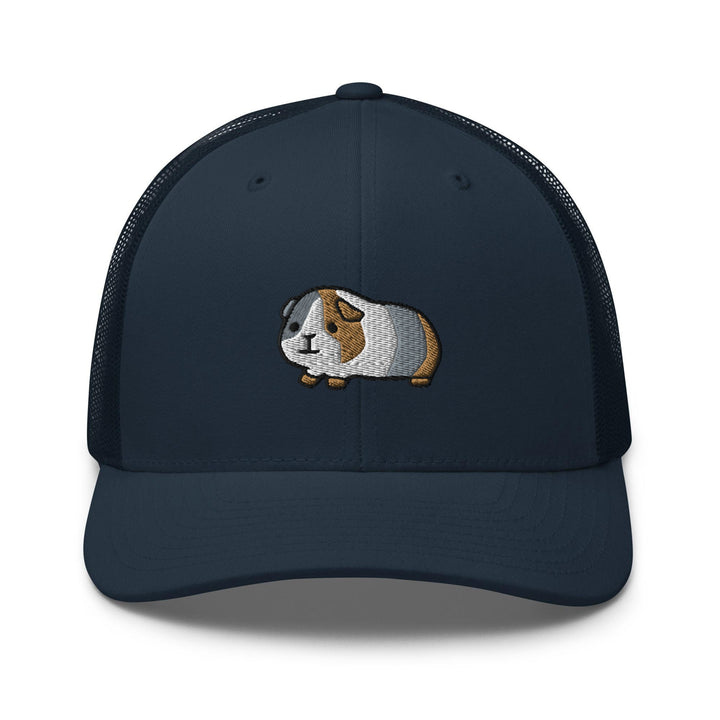 a blue cap with a brown and white dog on it