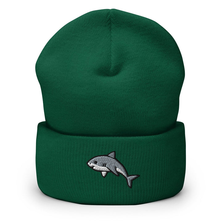 a green hat with a shark embroidered on it