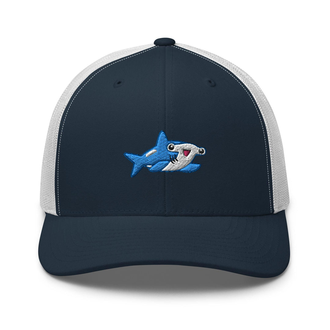 a blue and white hat with a shark on it