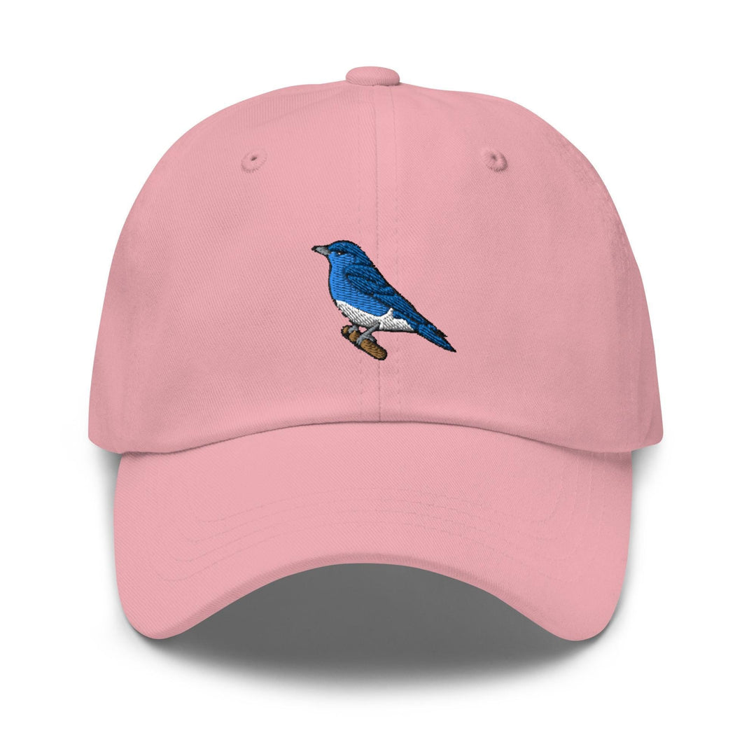 a pink hat with a blue bird on it