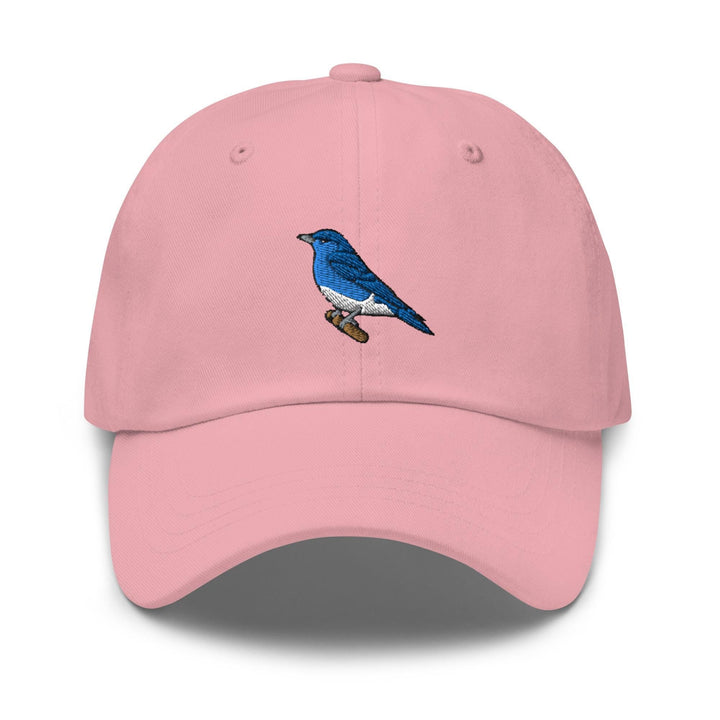 a pink hat with a blue bird on it
