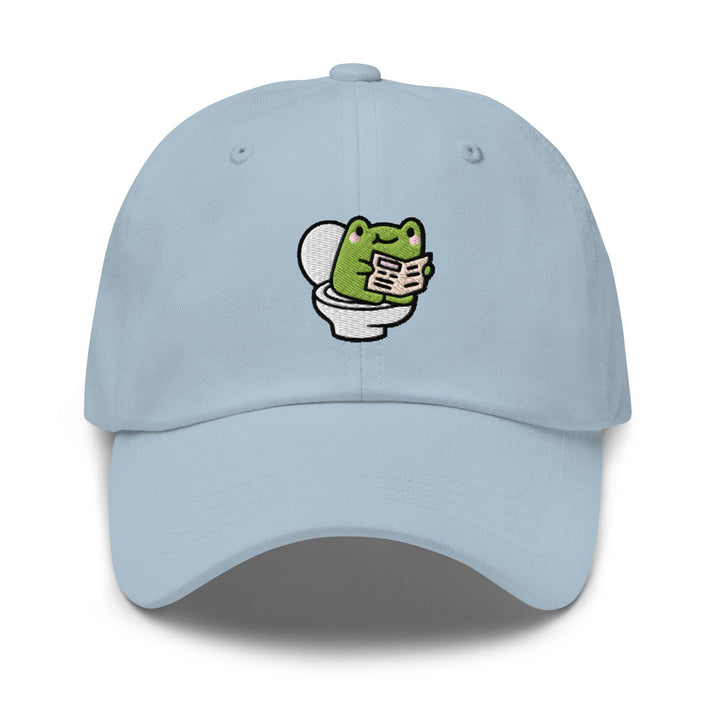 a light blue hat with a frog on it