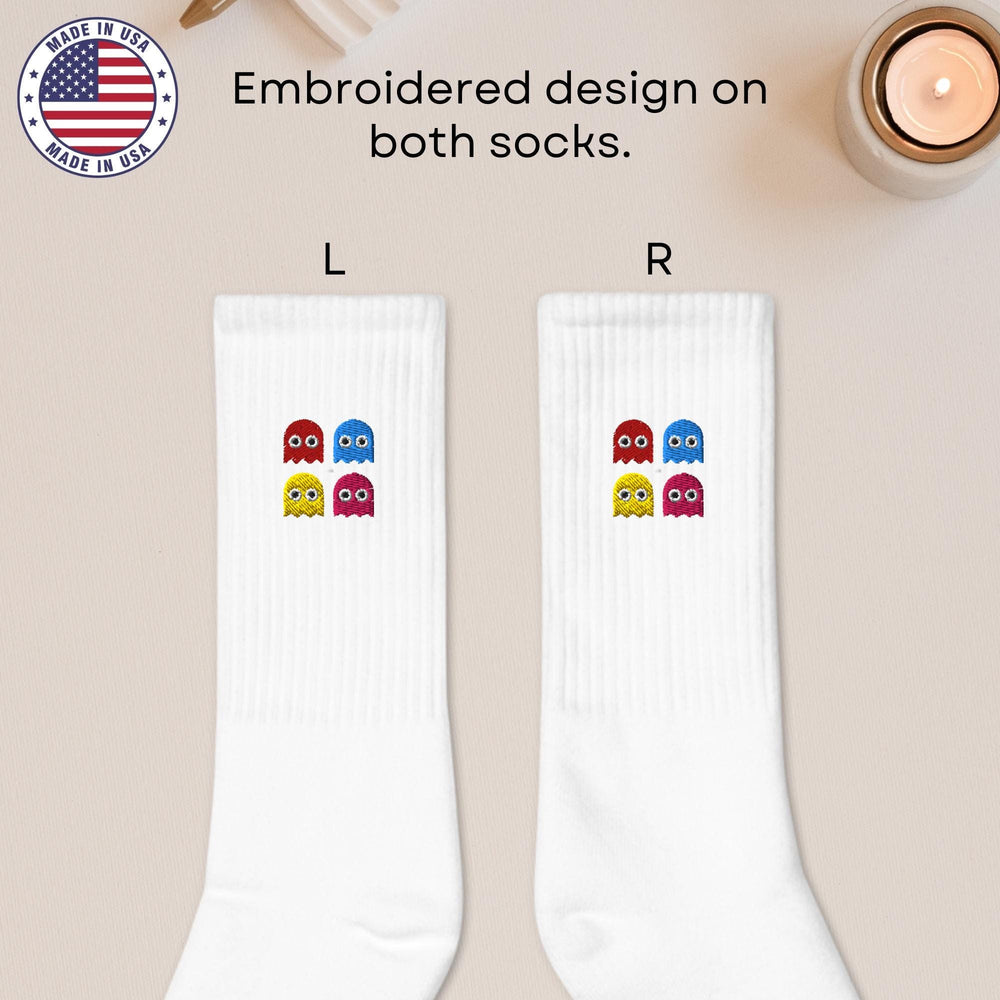 a pair of white socks with two owls on them