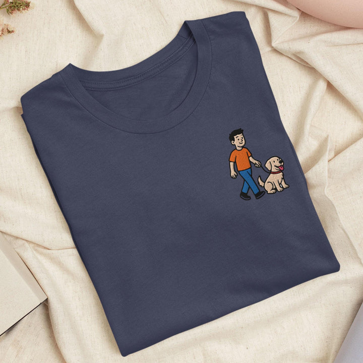 a blue t - shirt with a picture of a man and a dog on it