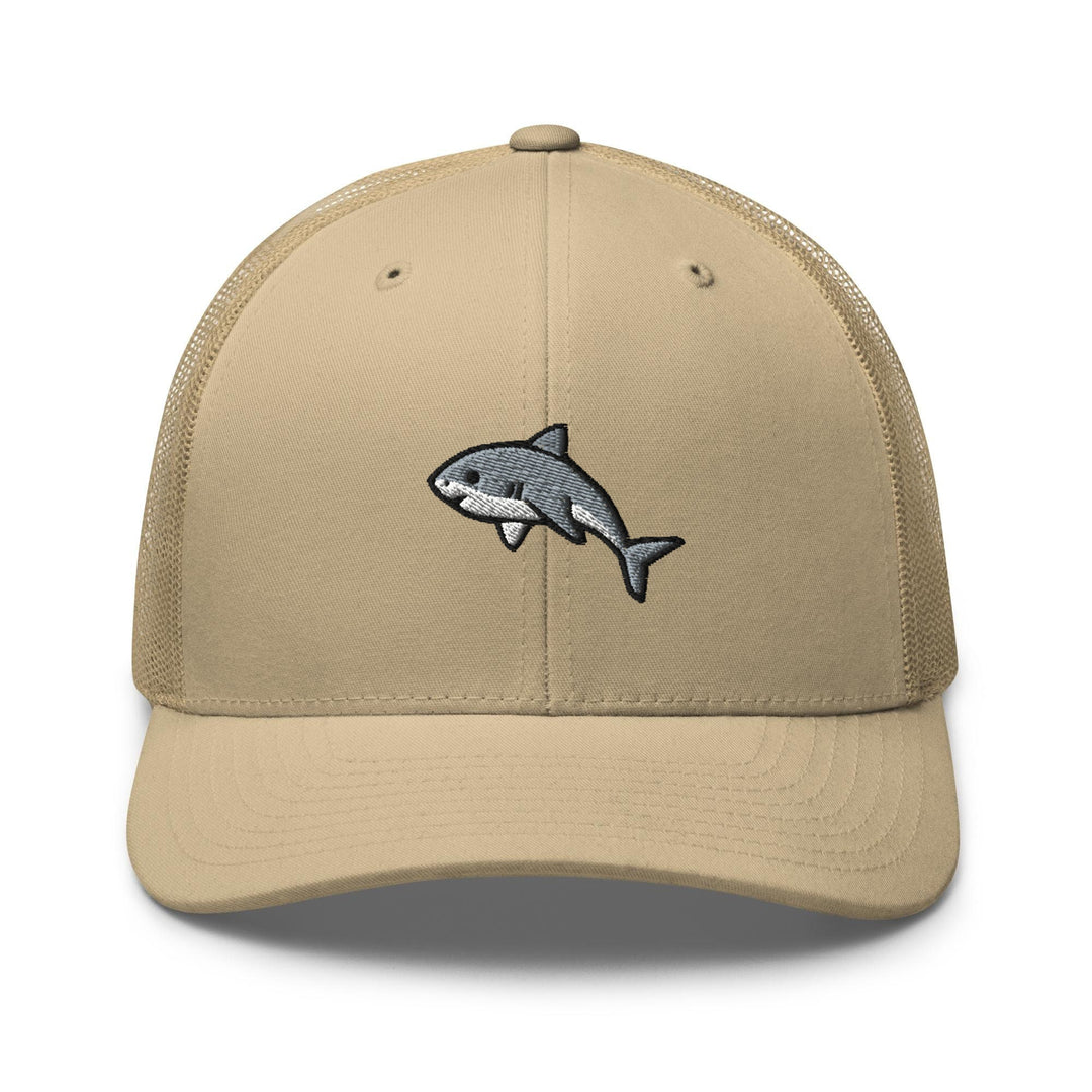 a tan hat with a shark embroidered on the front