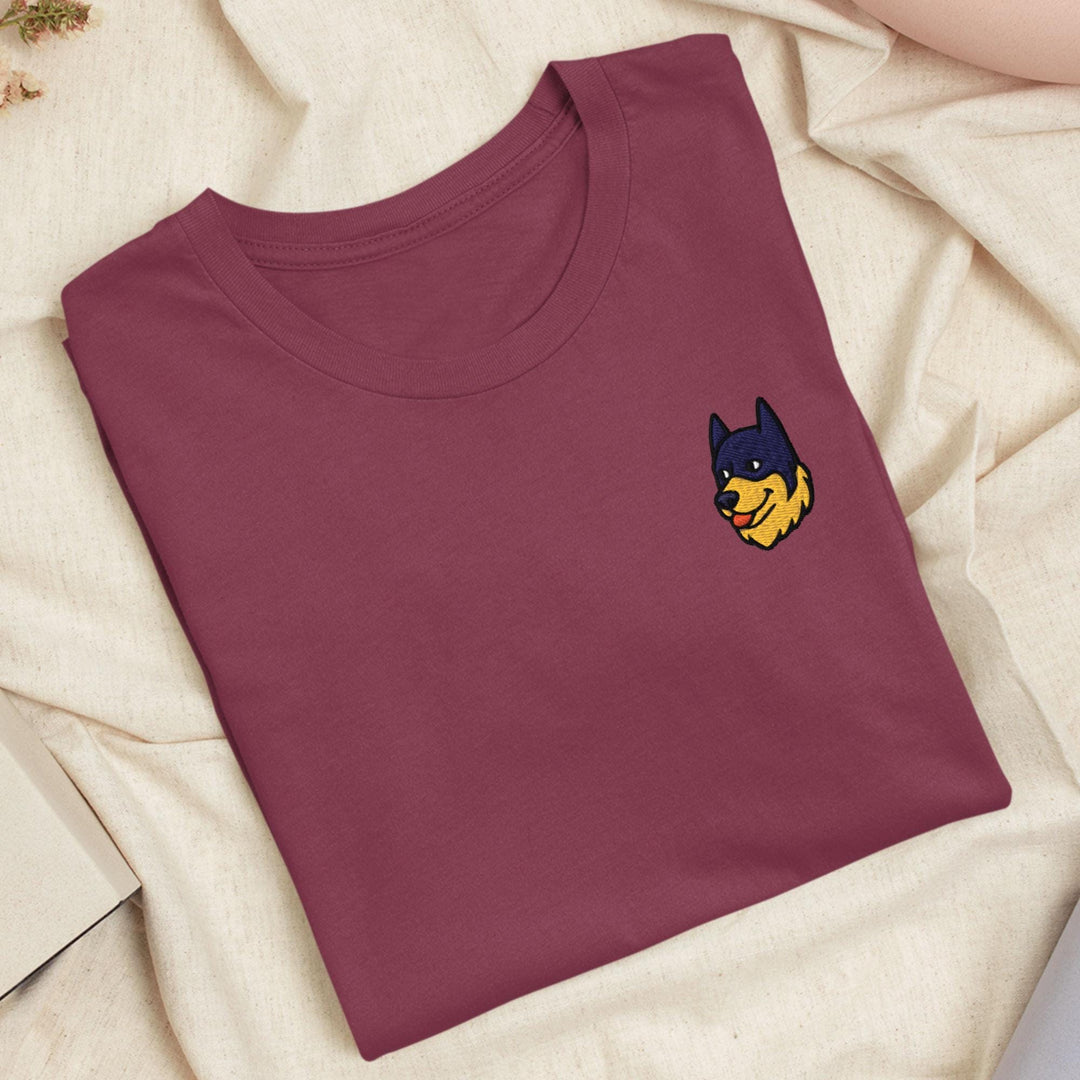 a red t - shirt with a batman embroidered on the chest