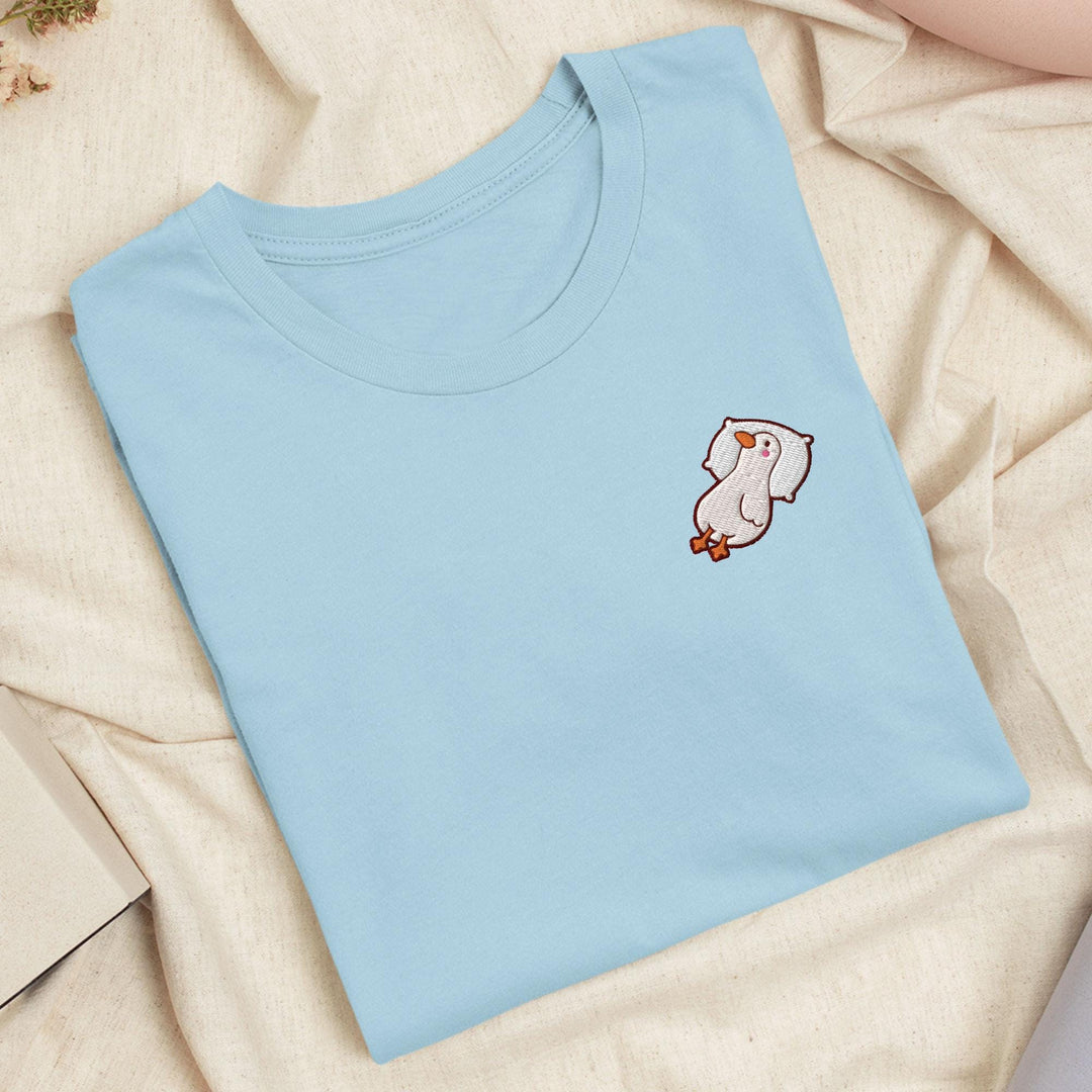 a blue t - shirt with a picture of a cat on it