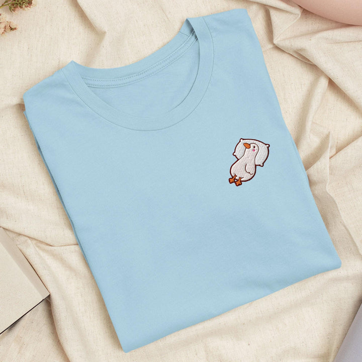 a blue t - shirt with a picture of a cat on it