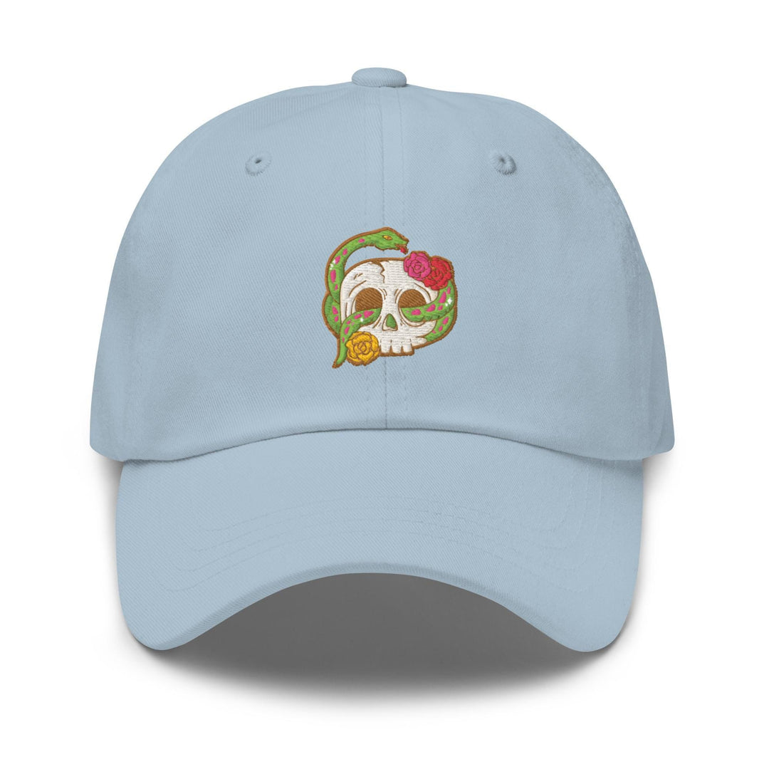 a light blue hat with a skull on it