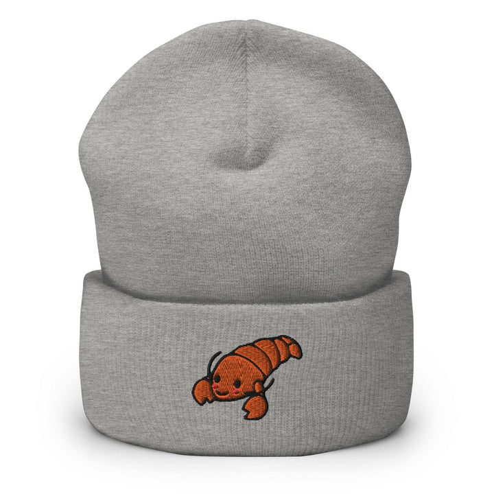 a gray beanie with an orange fish on it