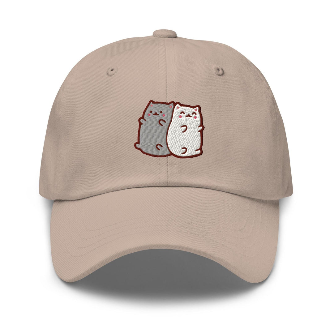 a baseball cap with two cats on it