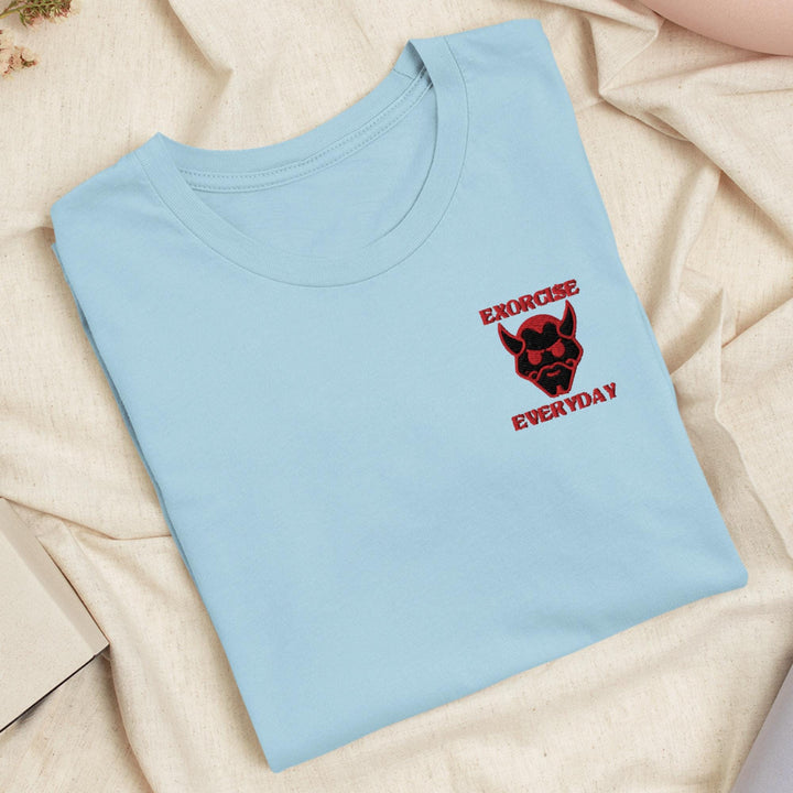 a blue t - shirt with a red skull on it