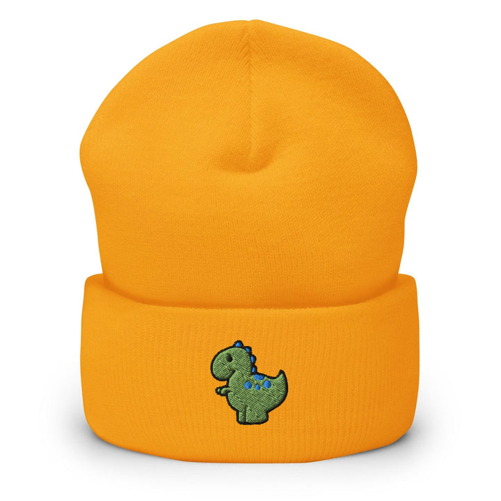 a yellow beanie with a green dinosaur embroidered on it