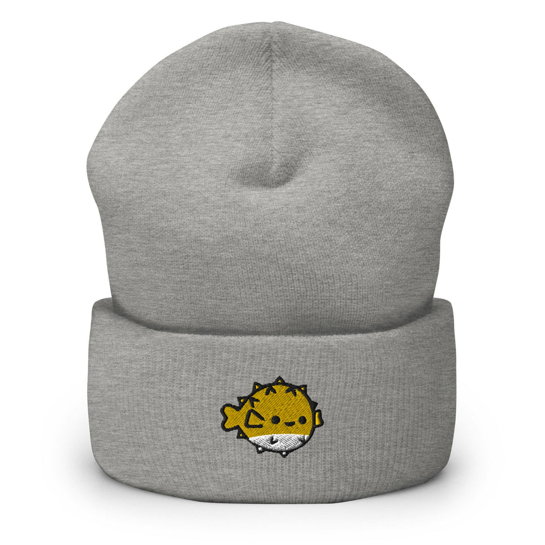 a grey beanie with a yellow lion on it