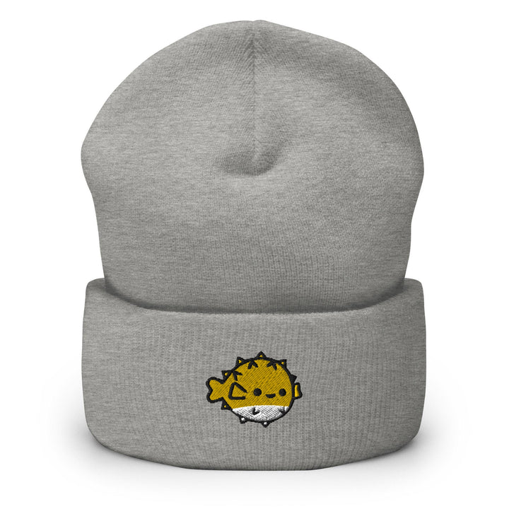 a grey beanie with a yellow lion on it
