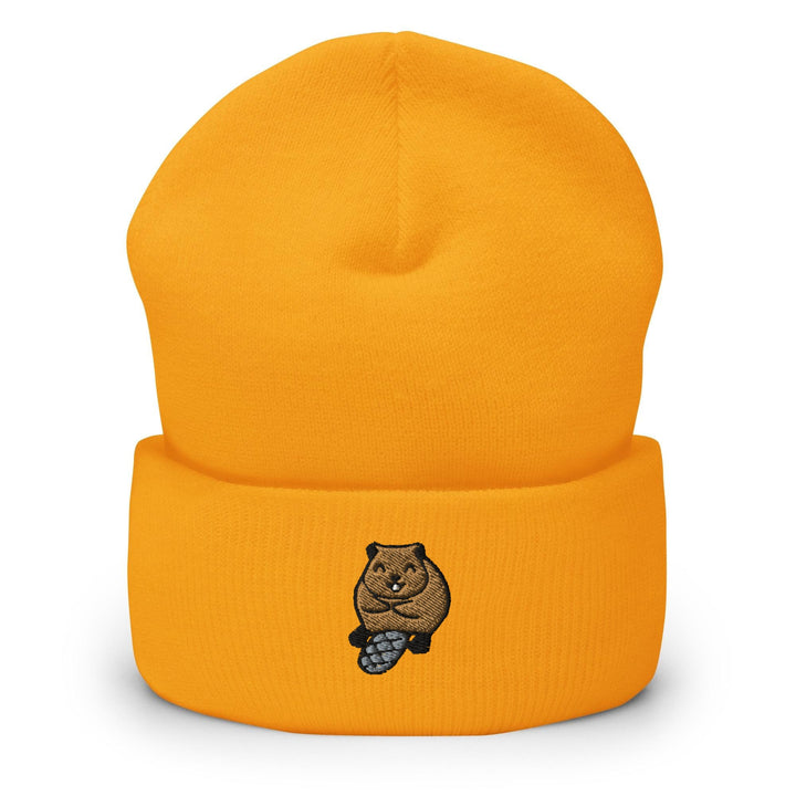 a yellow beanie with a bear on it