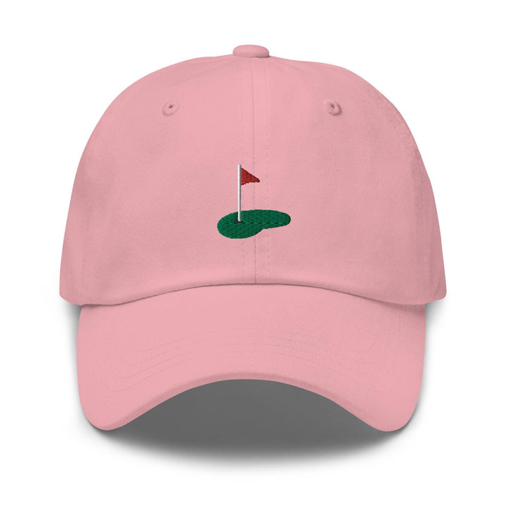 a pink hat with a red flag on it