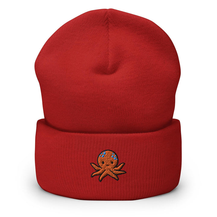 a red beanie with an octopus embroidered on it
