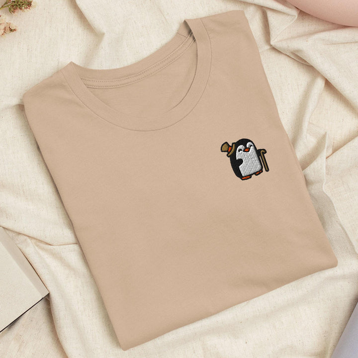 a t - shirt with a picture of a penguin on it